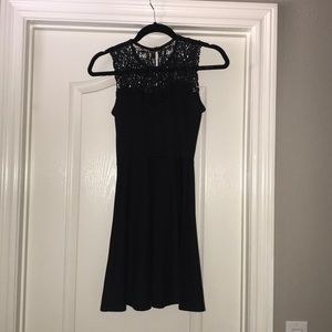 Black medium length, lace top dress.